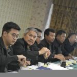 Ray Law attorneys in a strategy meeting discussing case preparation and litigation strategy.